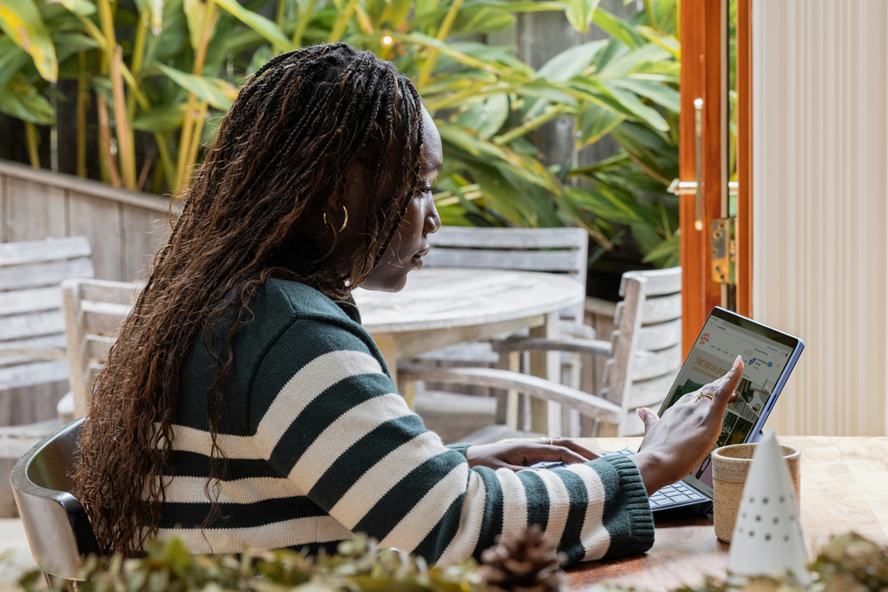 person working on her tablet